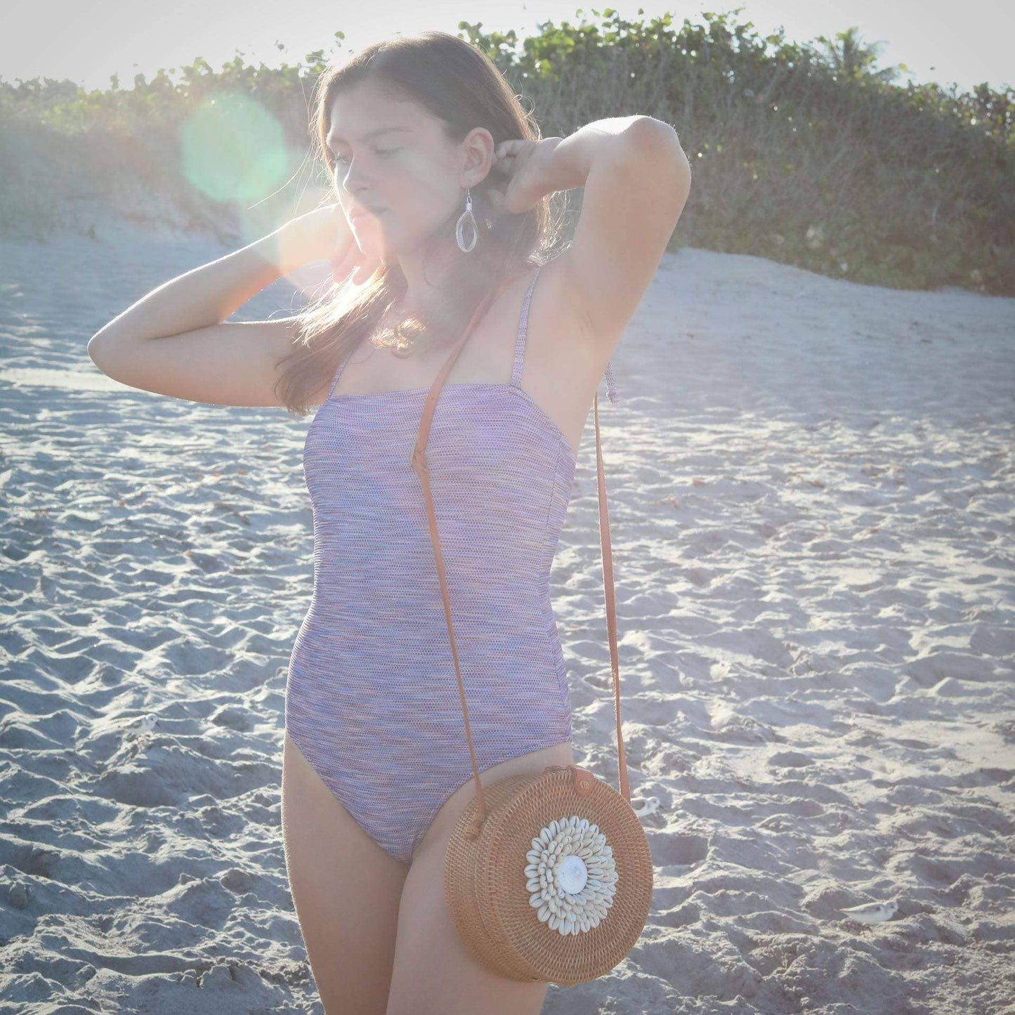 Ganapati Bali Rattan Crossbody Bag with Seashell Embellishment